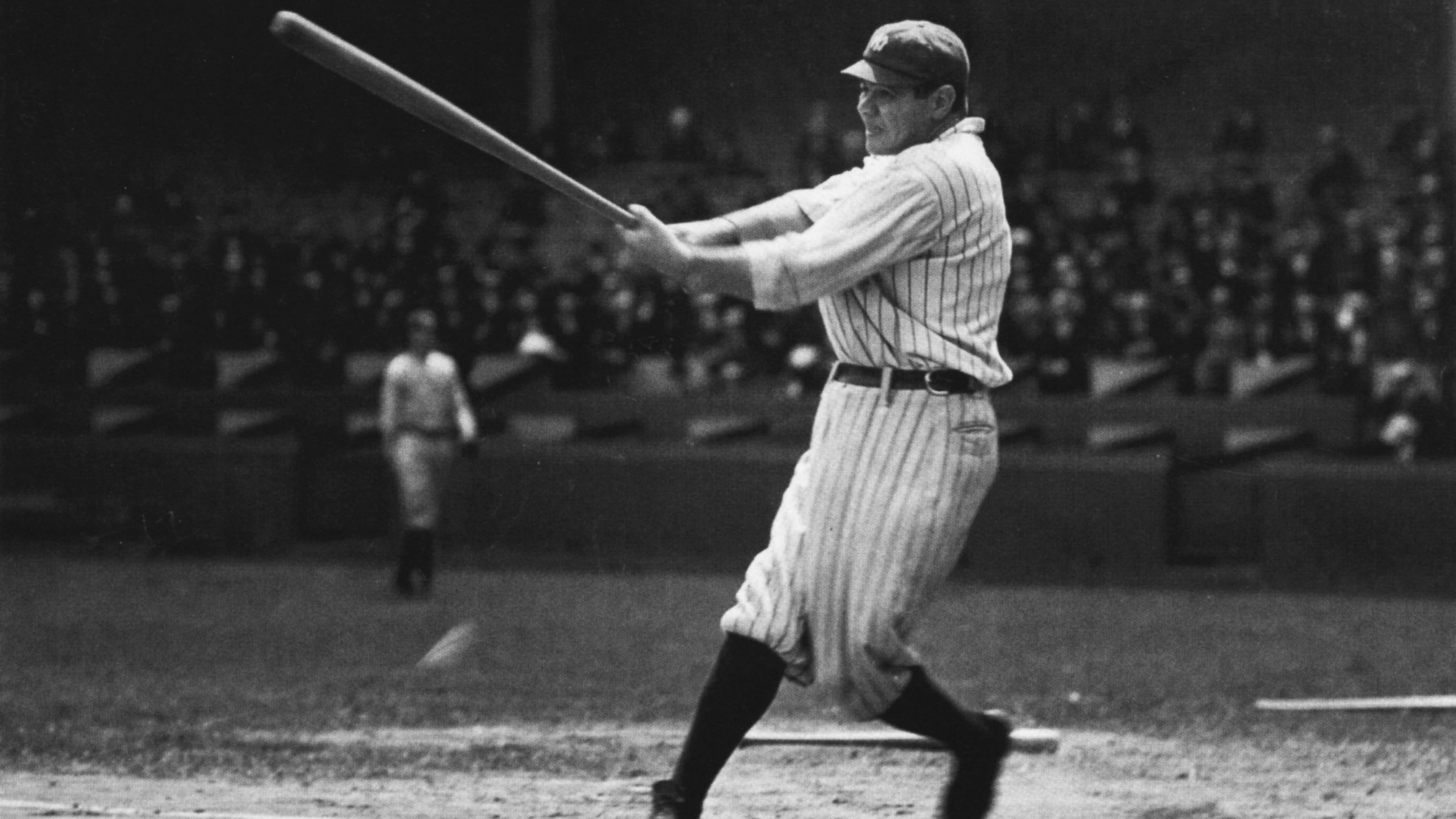 babe ruth in full swing doing what he does best
