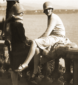 young ladies dressed in the fashions of the 1920s, knee length skirts, kitten heels, cloche hats
